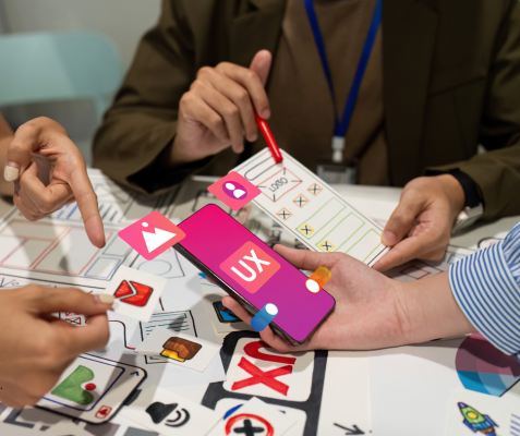 UX. mobile with pink background and the letters UK in white